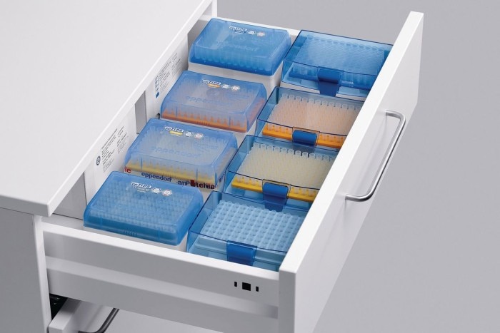 A drawer full of tip boxes for different volume class pipettes, symbolized by different colors.