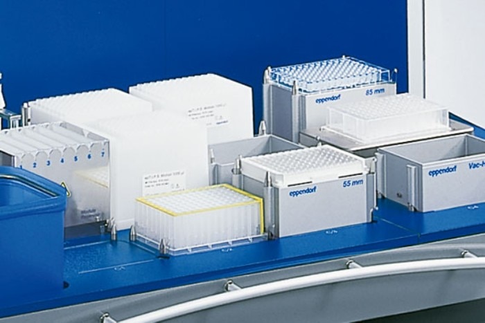 Big automated liquid handling system from Eppendorf with empty spaces for accessories.