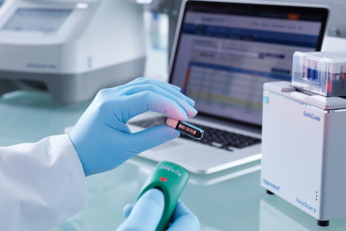 Lab worker scanning samples to be stored with our freezer inventory system