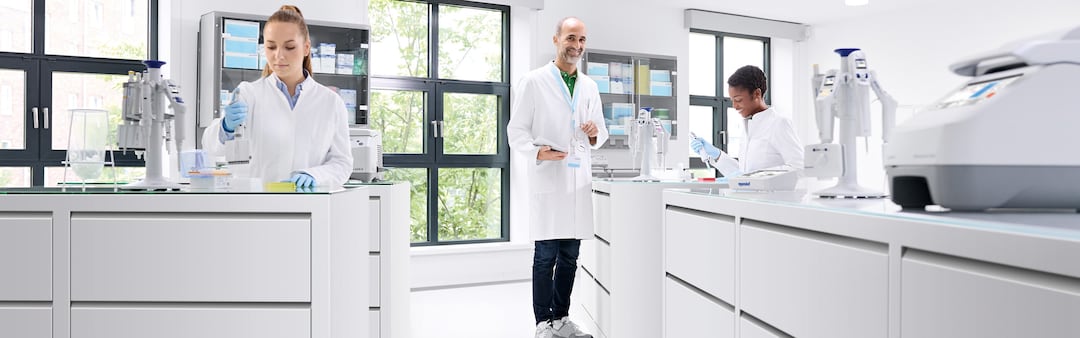 Lab Scientists Using Premium Eppendorf Liquid Handling Systems